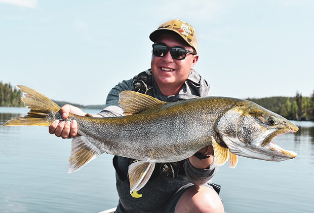 HuntFishMB hunting expert Keevin Erickson with a Giant Lake Trout
