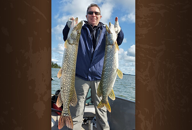 Ric McNulty with two Giant Pike