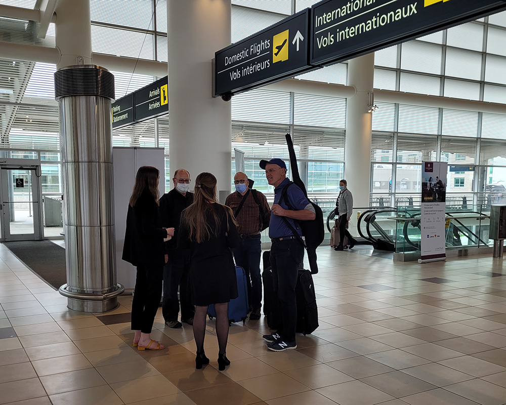 Guests arriving at Winnipeg Airport being greeted by Kississing Staff